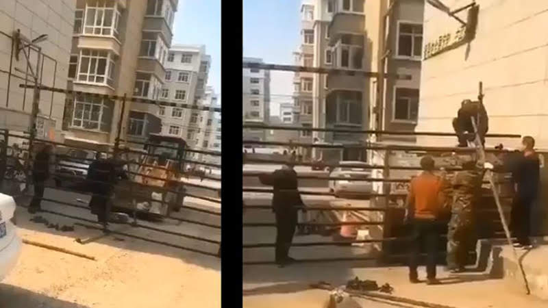 В Харбине рабочие строят временную стену для изоляции жилого комплекса. Скриншот с видео china-today.ru