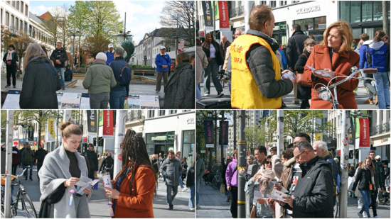 Практикующие рассказывают прохожим о Фалунь Дафа в центре Антверпена, 9 апреля 2022 года